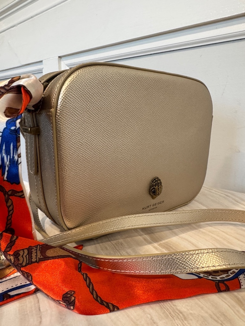Kurt Geiger Metallic Gold Crossbody Bag with Red-Orange Scarf Accent